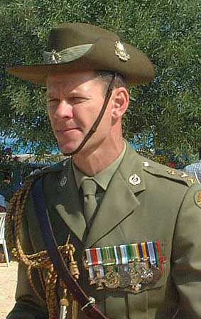 Australian aide de camp laying wreath